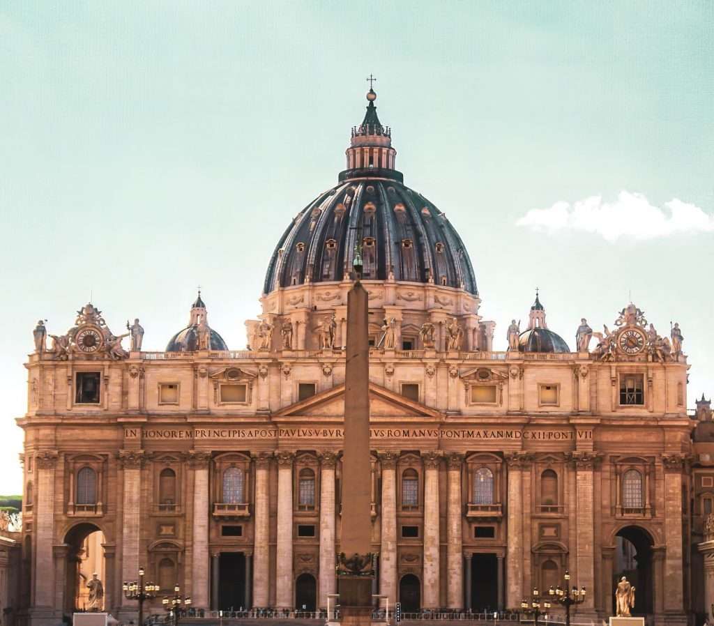 Front view of St. Peter's Basilica in Rome during the evening.